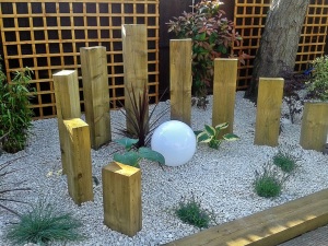 THE ROCKERY GARDEN WITH ROUND WOODEN CONSTRUCTION